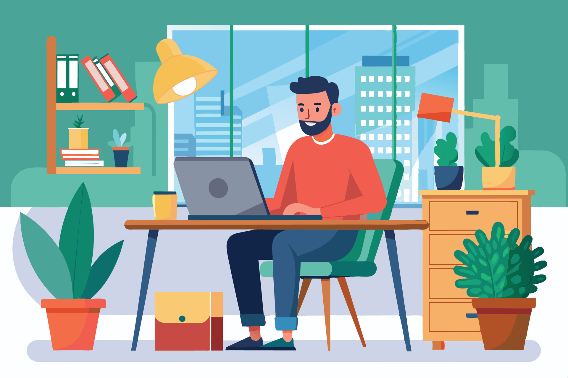 A focused creator working at a laptop in a home office.